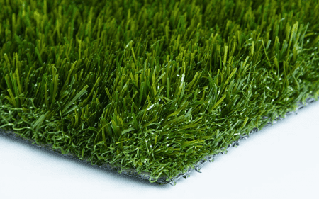 Close-up view of a green artificial grass mat.