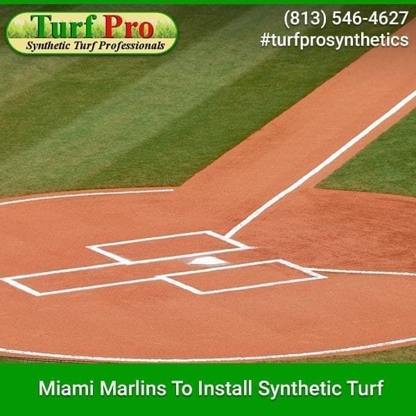 A synthetic turf baseball field with Miami Marlins branding.