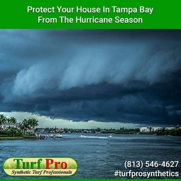 Hurricane clouds over Tampa Bay with protective service ad.