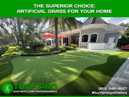 Artificial grass installed in a spacious backyard with patio furniture and a pool.