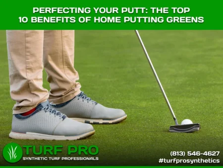 Person putting on a home putting green, focusing on the ball and putter.