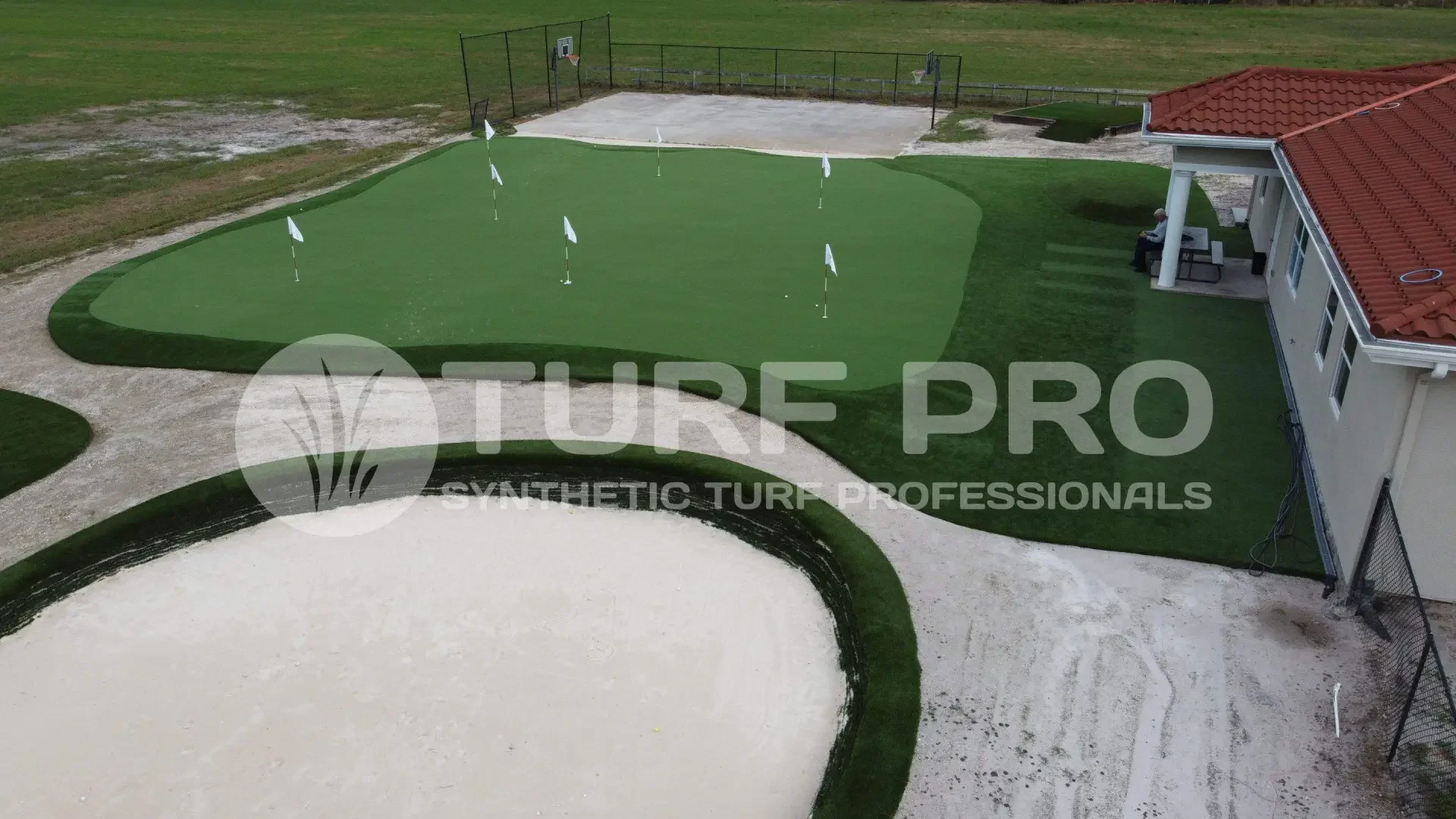 Golf practice area with sand bunkers and putting greens.