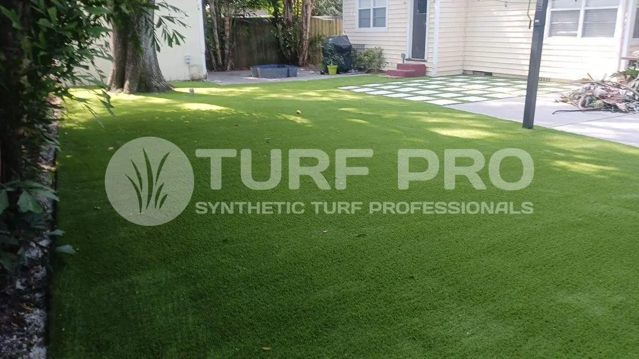Freshly installed synthetic turf with clear branding of Turf Pro.