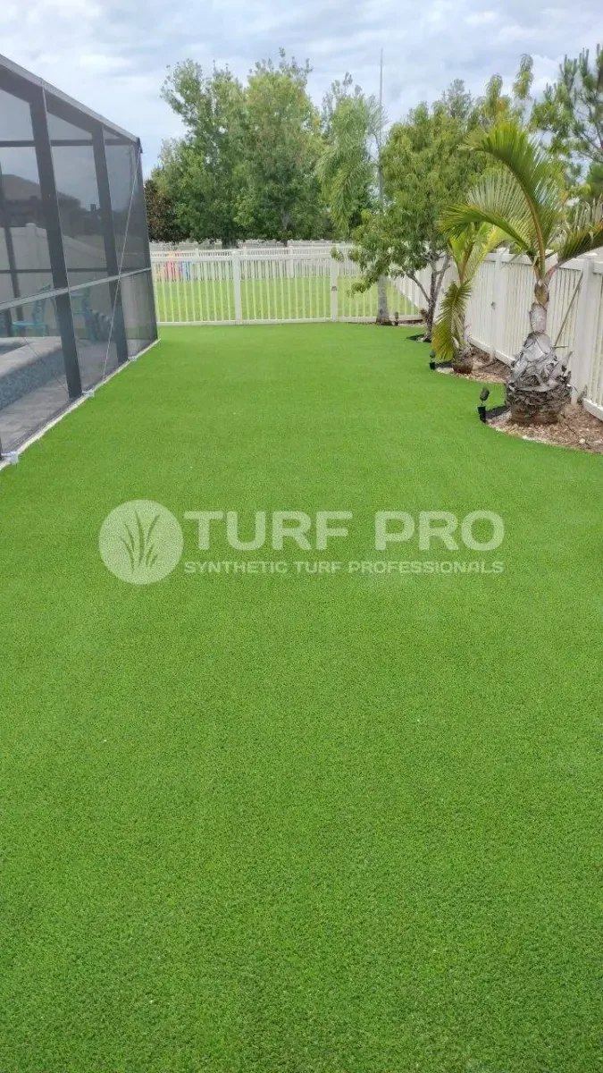 Well-maintained artificial turf lawn in a backyard.