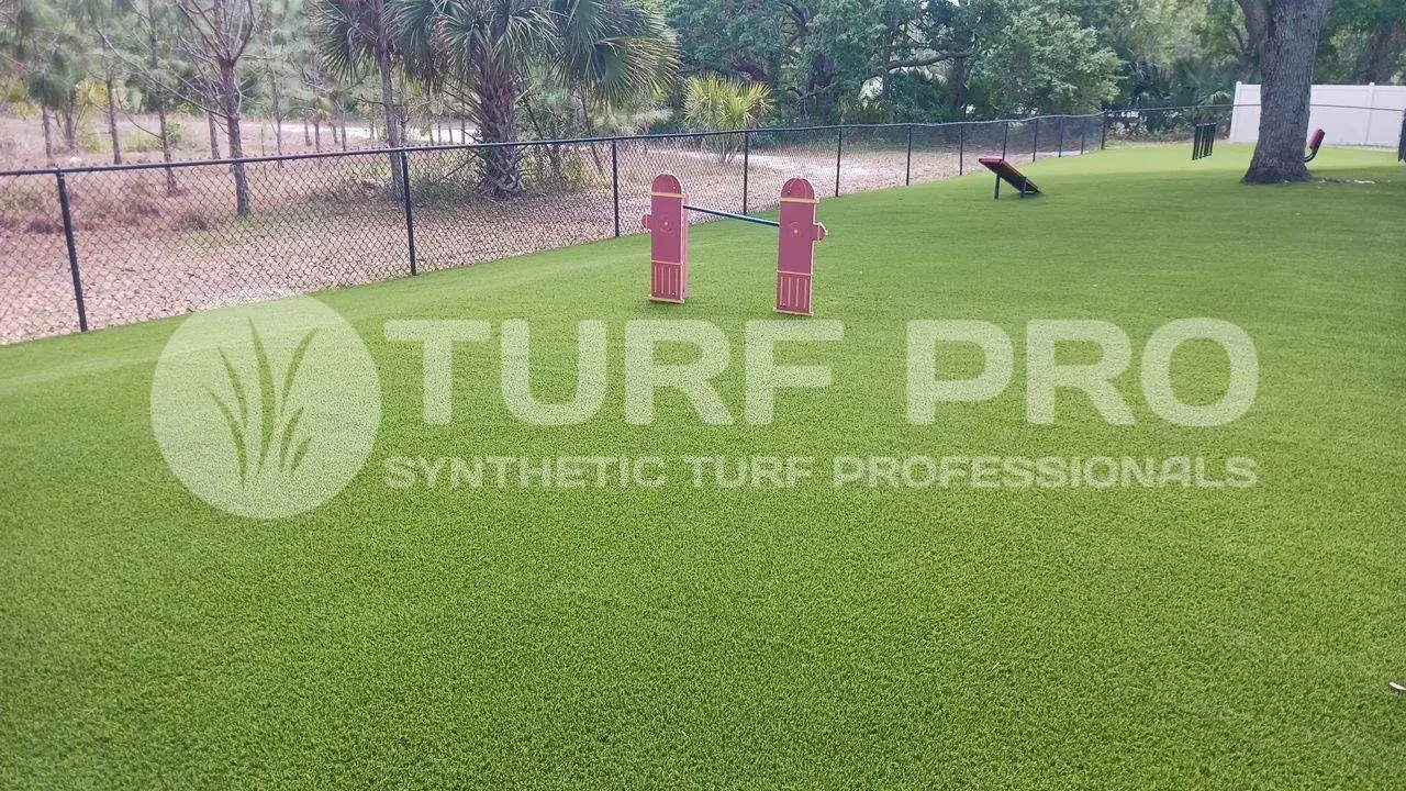 Green synthetic turf professionally installed in an outdoor area.