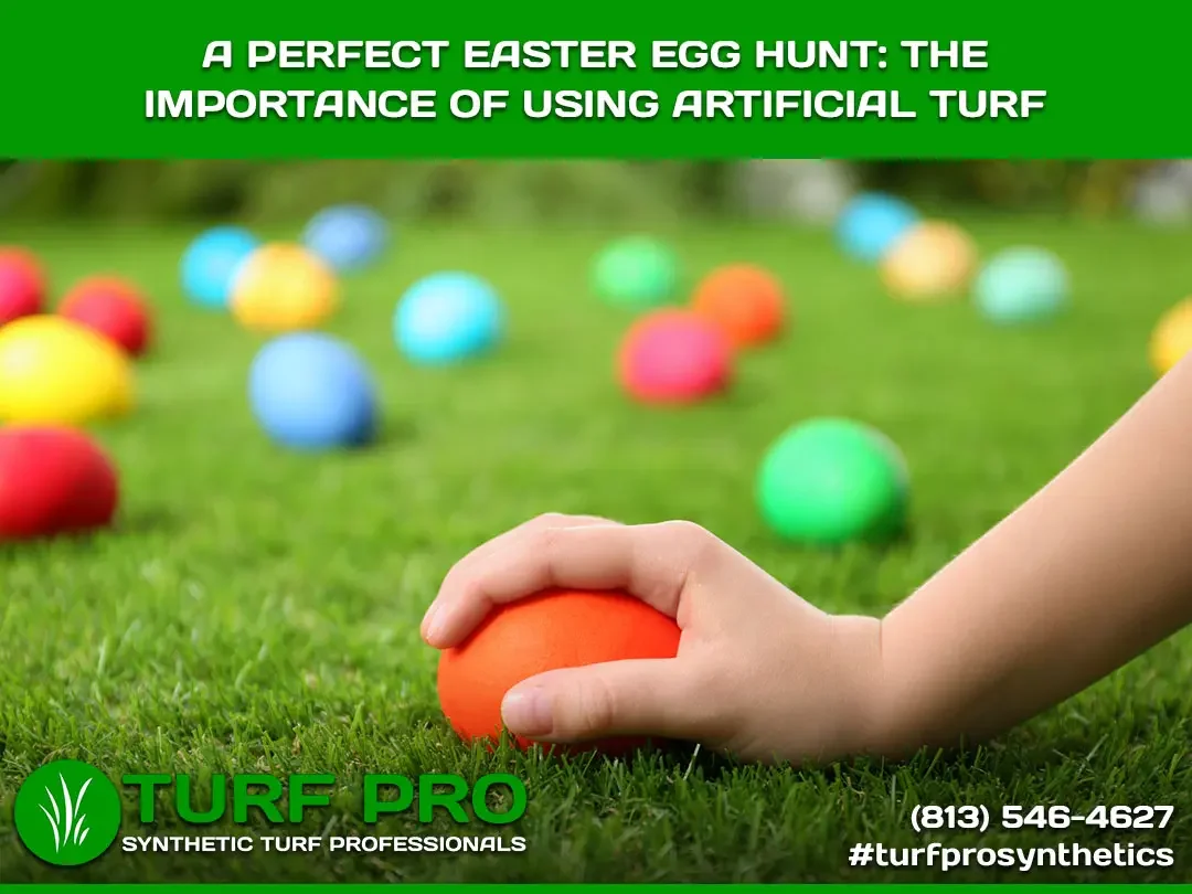 Child holding an Easter egg on vibrant artificial turf with colorful eggs scattered around.