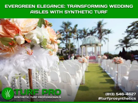 Wedding aisle adorned with white chairs and synthetic turf under a floral archway.